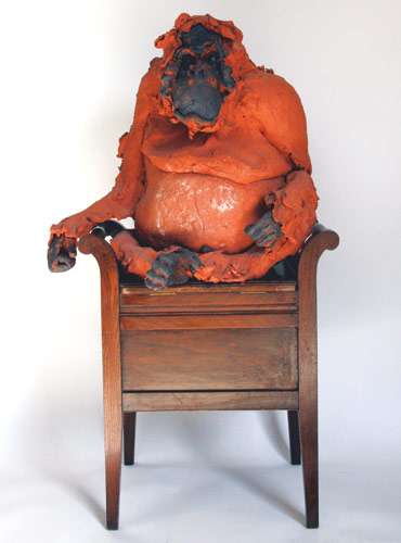 Orangutan sat in chair